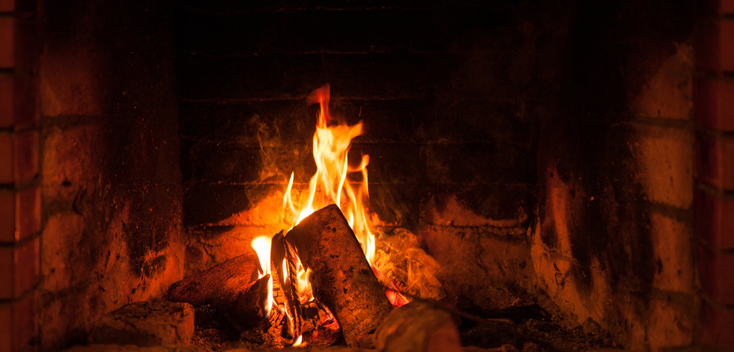 Fireplace with lit fire