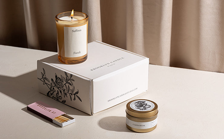 Candle of the Month Deluxe featuring two candles and a match box